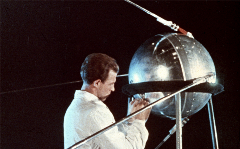 A technician puts finishing touches on Sputnik 1